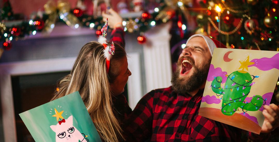 Smiling Guests at Private Christmas Event Being Hosted at Paint Cabin in 2023