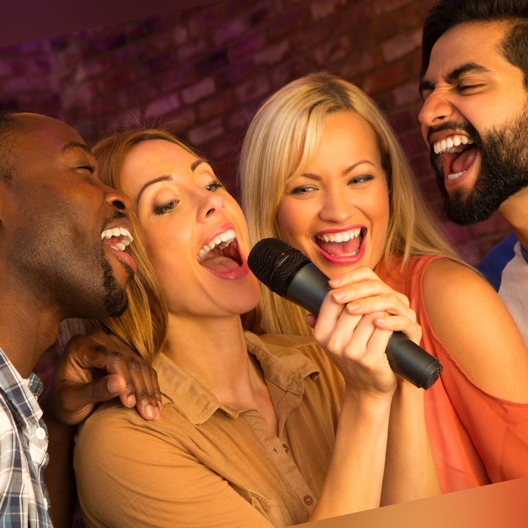 Group singing karaoke and having fun at a Karaoke Paint Party