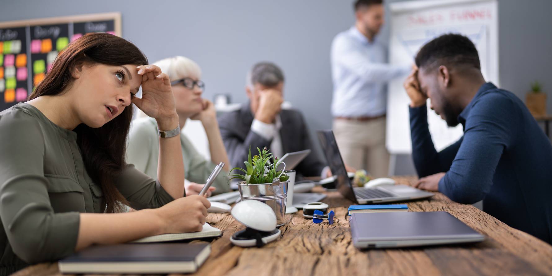 Image of disengaged office people during a meeting