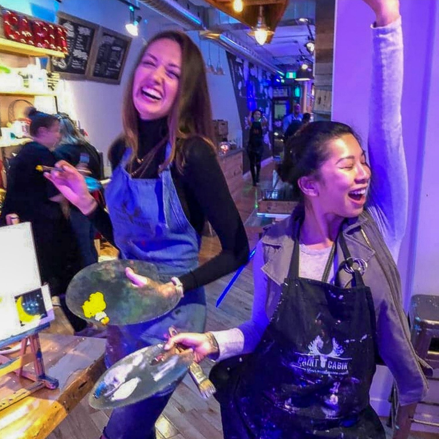 Two Girls Enjoying a Fun Team Building Event at Toronto's Paint Cabin