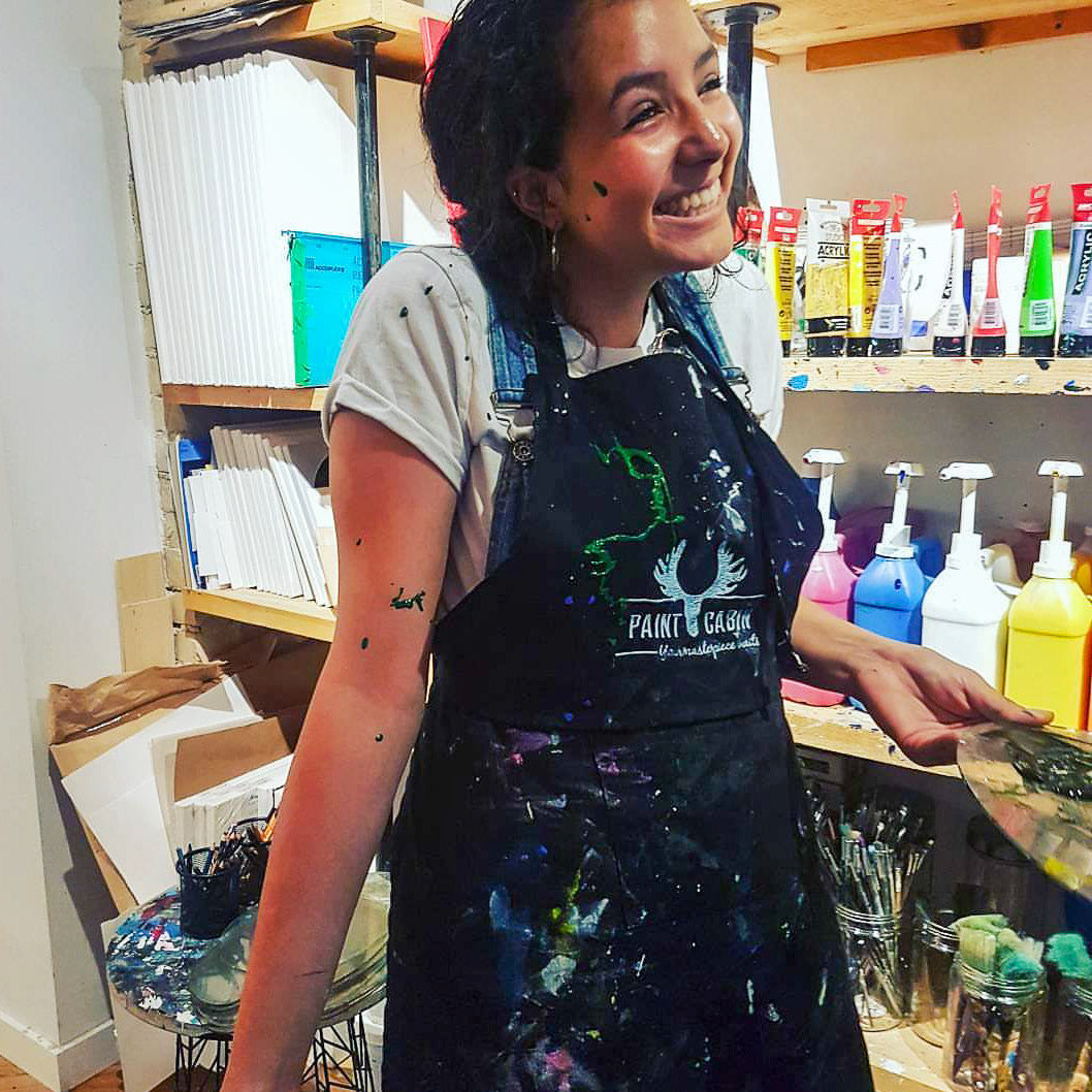 Happy Participant Enjoying a Paint Party at Paint Cabin