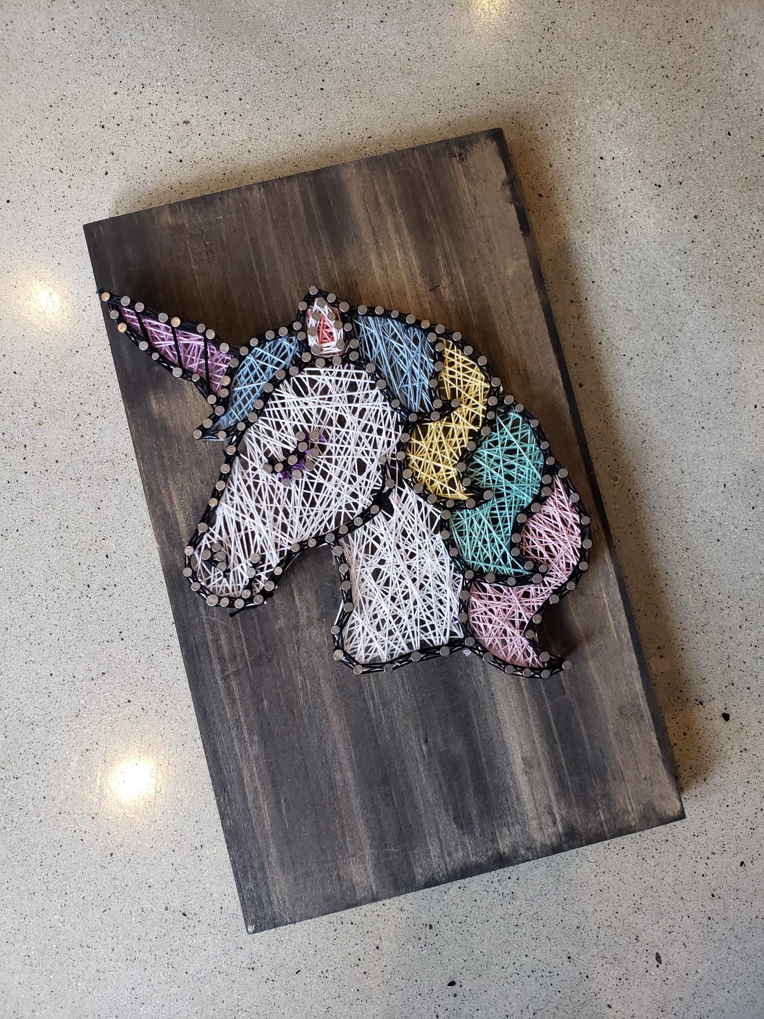 A Completed DIY String Art of a Unicorn at Paint Cabin